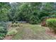 Backyard garden with a decorative fence and wooden stairs at 5010 Bonnie Way, Roswell, GA 30075