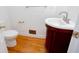 Half bath with unique vanity and hardwood floors at 5010 Bonnie Way, Roswell, GA 30075