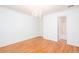 Bedroom with hardwood flooring, chandelier, and adjoining bathroom at 5010 Bonnie Way, Roswell, GA 30075