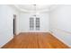 Bright dining room with hardwood floors, chandelier, and white trim throughout at 5010 Bonnie Way, Roswell, GA 30075