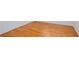 Close-up of shiny hardwood floors in a room with white trim at 5010 Bonnie Way, Roswell, GA 30075