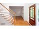 Inviting foyer with hardwood floors, white trim, and a staircase at 5010 Bonnie Way, Roswell, GA 30075