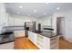 Well-appointed kitchen with stainless appliances and a large center island cooktop at 5010 Bonnie Way, Roswell, GA 30075