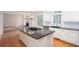 Bright kitchen with stainless appliances, gas cooktop, and eat in breakfast area at 5010 Bonnie Way, Roswell, GA 30075