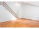 Stairway with hardwood floors and white trim at 5010 Bonnie Way, Roswell, GA 30075