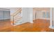 Open concept living space with hardwood floors, a staircase, and natural light at 5010 Bonnie Way, Roswell, GA 30075