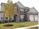 Charming two-story brick home with a well-manicured lawn and attached two-car garage at 947 Simonton View Ln, Lawrenceville, GA 30045