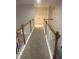 Upstairs hallway with neutral carpet and doors, offering a seamless transition between rooms and privacy for residents at 947 Simonton View Ln, Lawrenceville, GA 30045