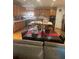 Spacious kitchen with oak cabinets, stainless steel appliances, and large island at 947 Simonton View Ln, Lawrenceville, GA 30045