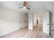 Large bedroom with light hardwood flooring, closet and ensuite bathroom at 103 Caracas Dr, Woodstock, GA 30188