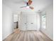 Spacious bedroom with a ceiling fan, double closets and light hardwood floors at 103 Caracas Dr, Woodstock, GA 30188