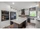 Elegant kitchen with stainless steel appliances, white cabinets, quartz countertops, and stylish island at 103 Caracas Dr, Woodstock, GA 30188