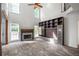 Large living room with built-ins, fireplace, hardwood floors, and high ceilings with abundant natural light at 103 Caracas Dr, Woodstock, GA 30188