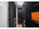 Custom walk-in closet with dark wood shelving, drawers, and ample storage space at 103 Caracas Dr, Woodstock, GA 30188