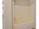 Clean bathroom features a shower-tub combo, updated fixtures, and neutral color scheme at 126 Usher Ln, Covington, GA 30016