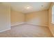 Bright bedroom with neutral walls and plush carpeting, offering a calm and inviting atmosphere at 126 Usher Ln, Covington, GA 30016