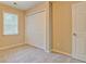 Bedroom featuring a window for natural light, a closet, neutral walls and plush carpeting at 126 Usher Ln, Covington, GA 30016