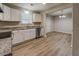 Bright kitchen features white cabinets, granite countertops, and stainless steel appliances at 126 Usher Ln, Covington, GA 30016