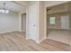 Open-concept living room with fresh paint, new flooring, and abundant natural light at 126 Usher Ln, Covington, GA 30016
