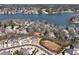 Beautiful aerial view of lakeside homes and tennis court with lake access at 320 Dodd Ln, Alpharetta, GA 30005