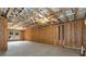 Partially finished basement featuring exposed wood frame construction and concrete flooring with natural light at 320 Dodd Ln, Alpharetta, GA 30005