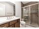 Modern bathroom featuring a glass-enclosed shower, a white vanity, and stylish fixtures at 320 Dodd Ln, Alpharetta, GA 30005