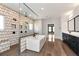 Modern bathroom featuring a soaking tub, walk-in shower, and dual sink vanity with dark cabinets at 320 Dodd Ln, Alpharetta, GA 30005