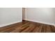 Empty bedroom showcasing wood floors and white trim, a neutral canvas for creating a personalized space at 320 Dodd Ln, Alpharetta, GA 30005