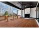Spacious outdoor deck with fireplace, offering an inviting space for relaxation and entertaining at 320 Dodd Ln, Alpharetta, GA 30005