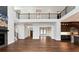 Spacious living area with soaring ceilings, open floor plan, and tons of natural light at 320 Dodd Ln, Alpharetta, GA 30005