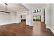 Open concept living room features hardwood floors, high ceilings, and seamless flow to kitchen at 320 Dodd Ln, Alpharetta, GA 30005