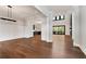 Open living space with wood floors, modern lighting, and views into the kitchen and out to the deck at 320 Dodd Ln, Alpharetta, GA 30005