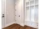 Mud room with custom built-in shelving, storage cabinets, and drawers, enhancing organization and functionality at 320 Dodd Ln, Alpharetta, GA 30005