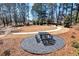 Outdoor picnic area with a table and bench set on a stone bed at 320 Dodd Ln, Alpharetta, GA 30005
