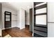 Organized walk-in closet with dark built-in shelving, drawers, and a door for easy access at 320 Dodd Ln, Alpharetta, GA 30005