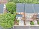 This is an aerial view of a brick two-story townhome with a rear deck, patio and drive-under carport at 5000 Davenport Pl, Roswell, GA 30075
