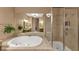 Bathroom with a large tub, granite counters, and a walk in shower at 5000 Davenport Pl, Roswell, GA 30075