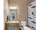 Bathroom with granite counters, a shark shower curtain and a beige cabinet at 5000 Davenport Pl, Roswell, GA 30075