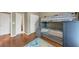 Lovely bedroom features a custom bunk bed, hardwood floors, and a playful rug, perfect for children at 5000 Davenport Pl, Roswell, GA 30075