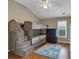 Cozy bedroom with custom bunk beds, carpet, and ample natural light offering a fun and inviting space for  at 5000 Davenport Pl, Roswell, GA 30075