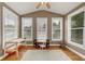 Bright bonus room with hardwood floors, ceiling fan, and lots of natural light at 5000 Davenport Pl, Roswell, GA 30075