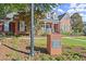 A charming brick building with a blue door serves as the community clubhouse at 5000 Davenport Pl, Roswell, GA 30075