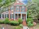 Charming two-story brick home with manicured landscaping and a welcoming front porch at 5000 Davenport Pl, Roswell, GA 30075