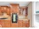 Modern kitchen with granite countertops, stainless steel appliances, double ovens, and wood cabinetry at 5000 Davenport Pl, Roswell, GA 30075