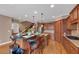 Bright kitchen featuring a granite island with seating, stainless appliances, and hardwood floors at 5000 Davenport Pl, Roswell, GA 30075