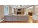 Living room with hardwood floors, built-ins, fireplace, and open to dining room at 5000 Davenport Pl, Roswell, GA 30075