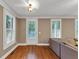 Bright living room with hardwood floors, neutral walls, and large windows with plantation shutters at 5000 Davenport Pl, Roswell, GA 30075