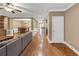 Open-concept living area flowing into a dining room with hardwood floors and neutral paint at 5000 Davenport Pl, Roswell, GA 30075