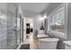 Bright bathroom with a large glass shower, a soaking tub and an open view to the bedroom at 1721 Mcgarity Rd, Temple, GA 30179