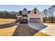 Charming two-story home with a manicured lawn, covered porch and attached two car garage at 1721 Mcgarity Rd, Temple, GA 30179